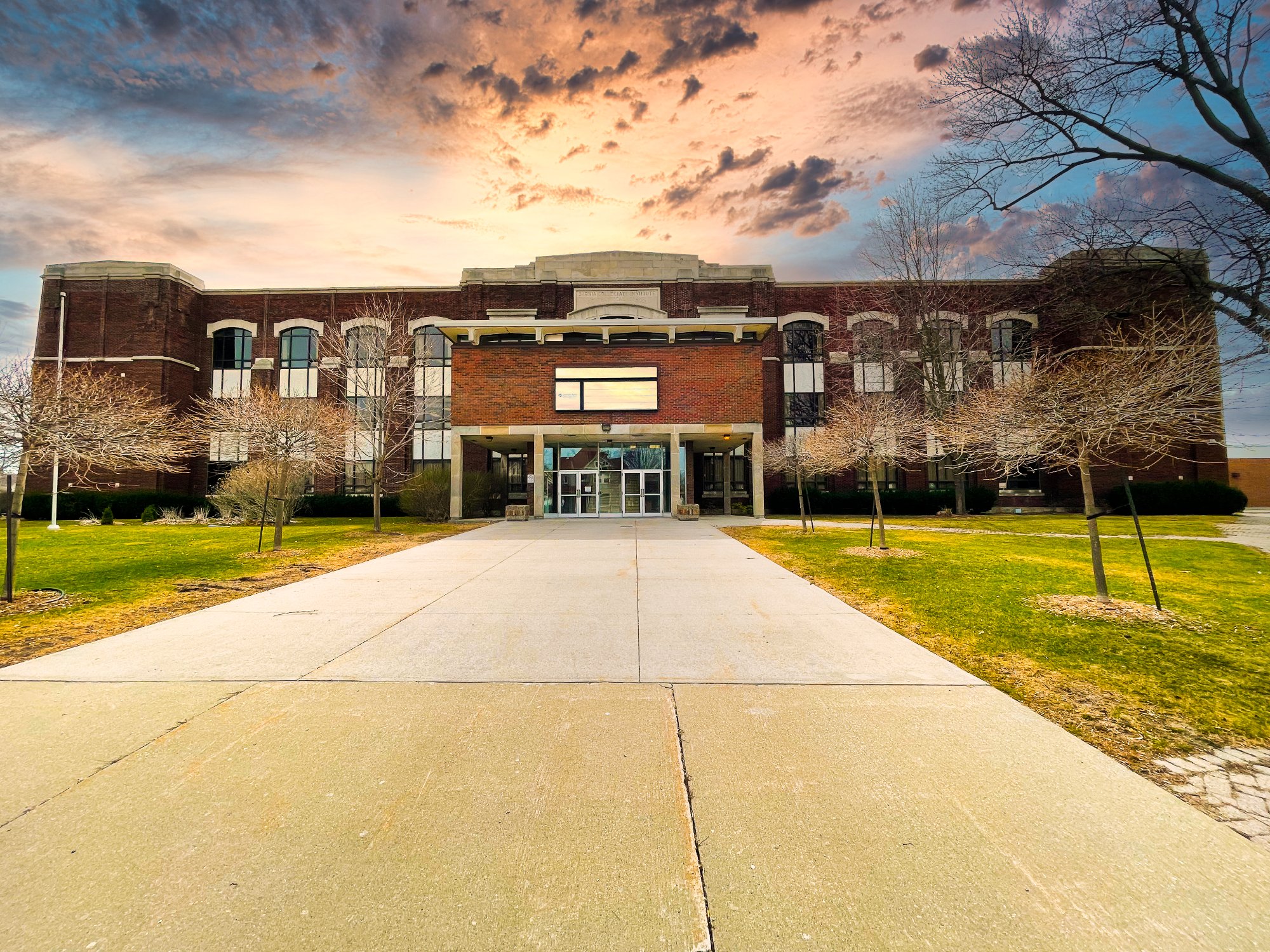 The historic SCITS building in Sarnia at sunset — home of The Anchor